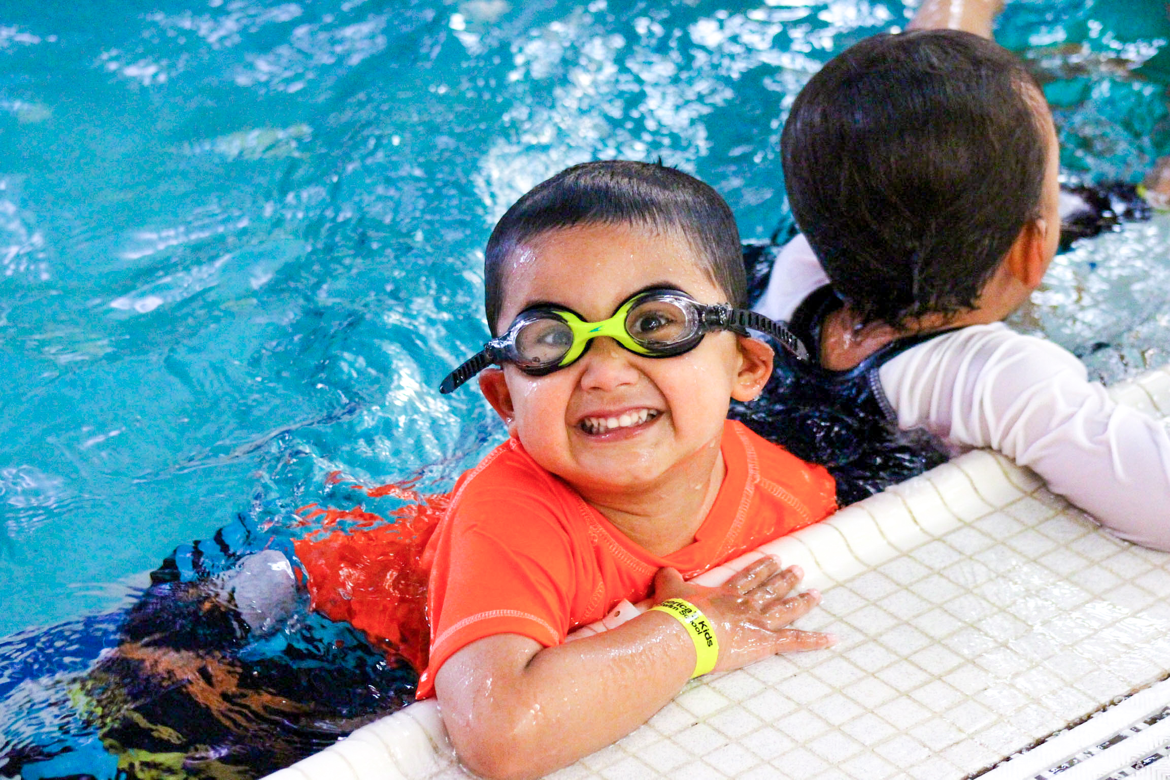 Preschooler loves group swim class