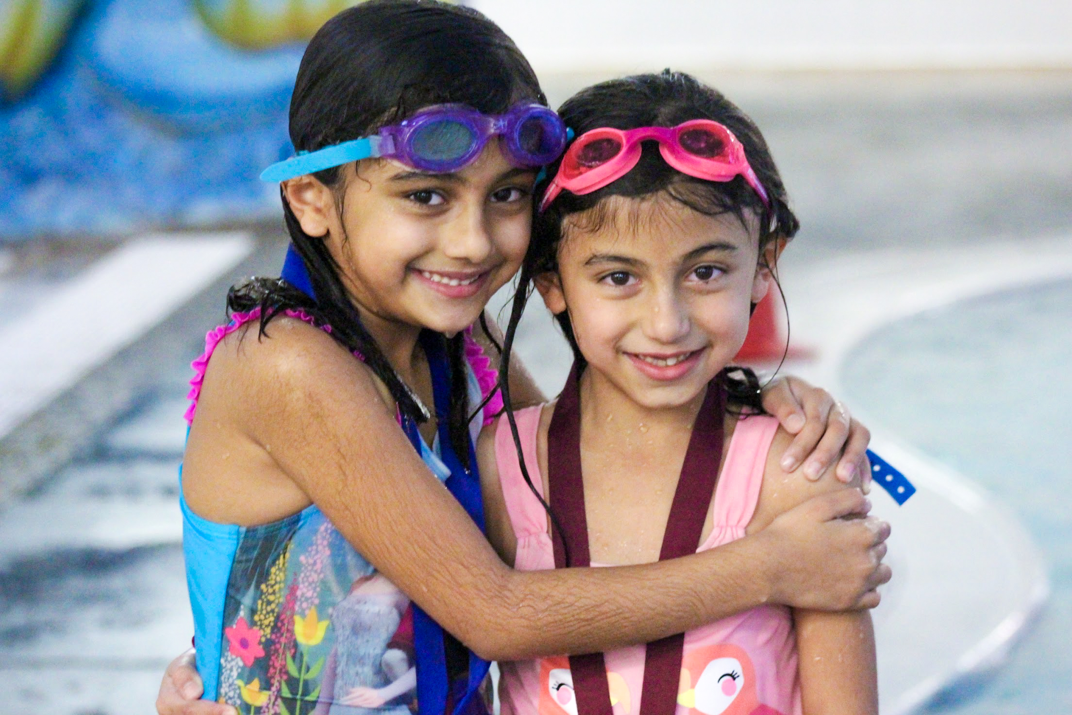 Sisters awarded for completing swim level