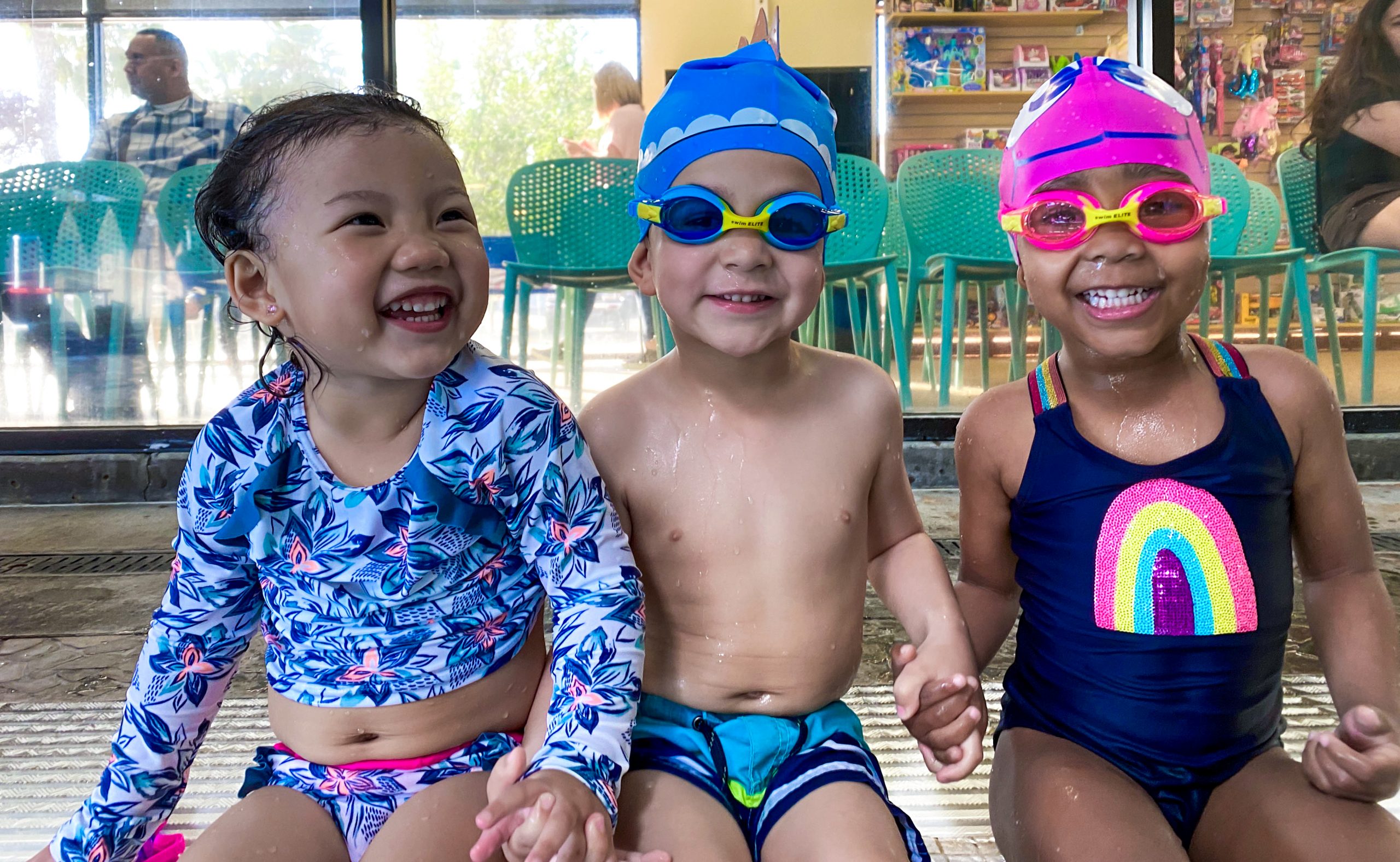 Toddler group class loves swim class with their friends