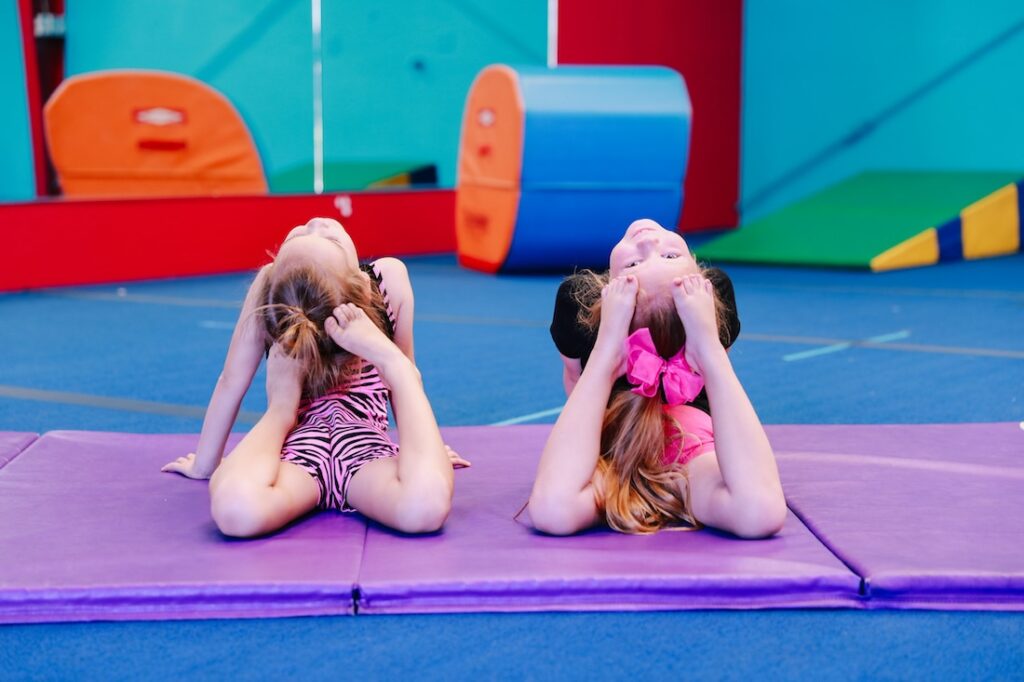 Young girls showing flexibility in gymnastics