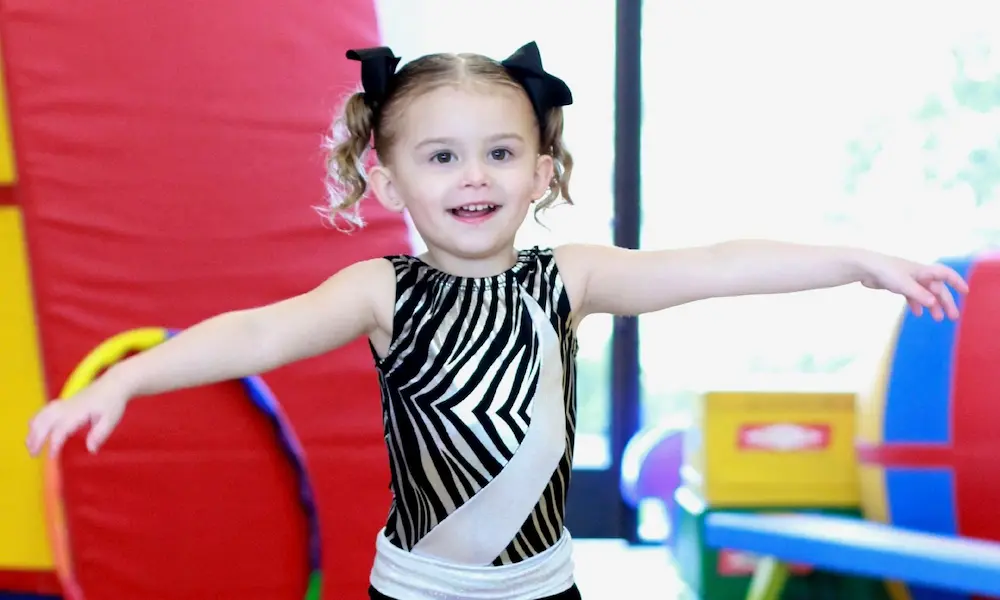 Young girl in a toddler gymnastics class at AKIM.